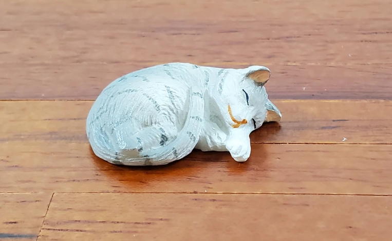 sleeping cat statue