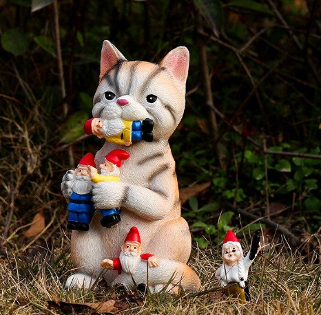 cat eating garden gnomes