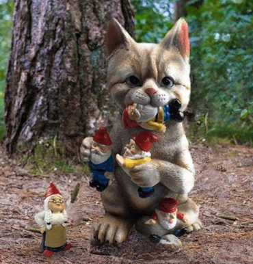 cat eating gnomes garden statue