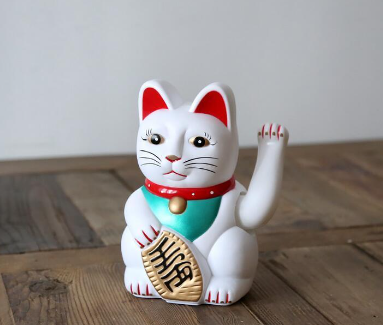 cat statue waving arm