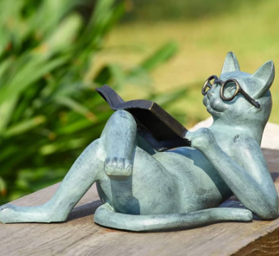 cat reading statue