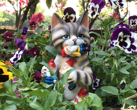 cat statue with gnomes