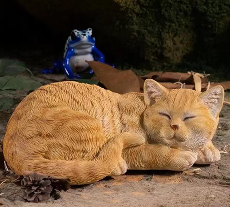 lounging cat statue