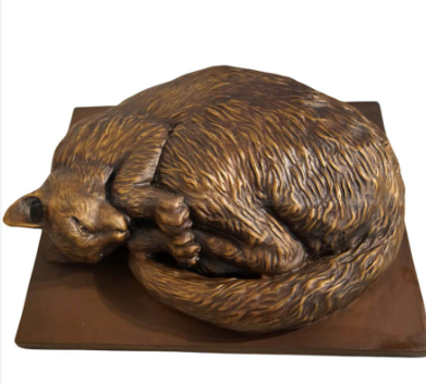 curled cat statue