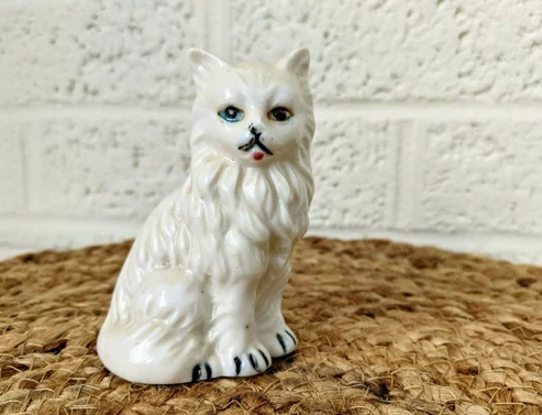 white ceramic cat figurine