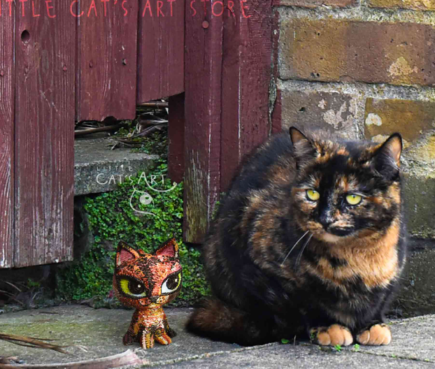 tortoiseshell cat statue
