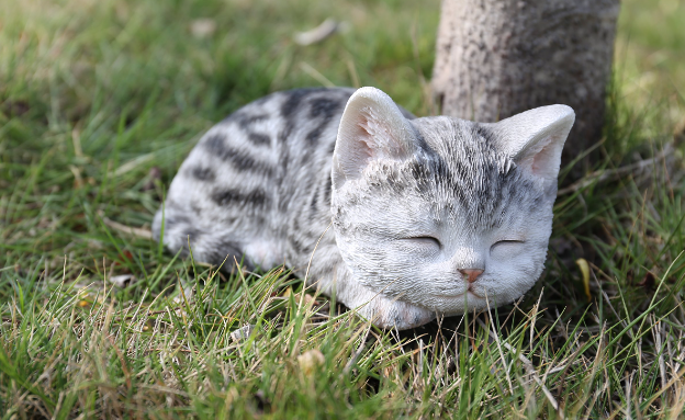 sleeping grey tabby cat statue