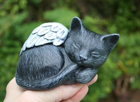 sleeping black cat garden ornament
