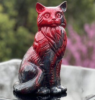 red cat statue