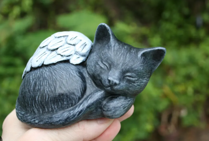 sleeping black cat statue