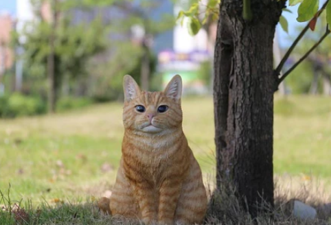 orange cat garden statue