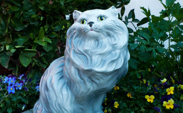 white ceramic cat statue